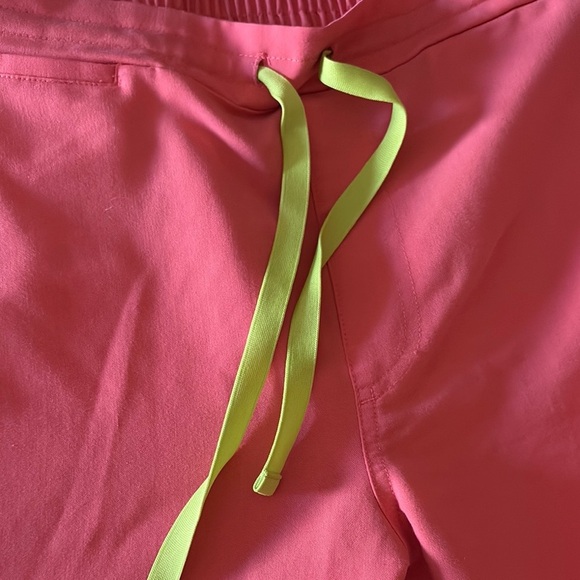 Gently loved Coral /Salmon Color Scrub Bottoms with Neon Accents by FIGS - Picture 2 of 10
